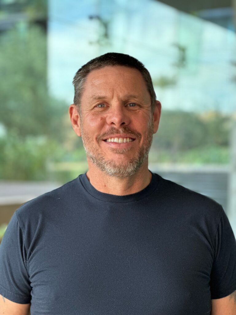 Photo of Chris Brubaker smiling